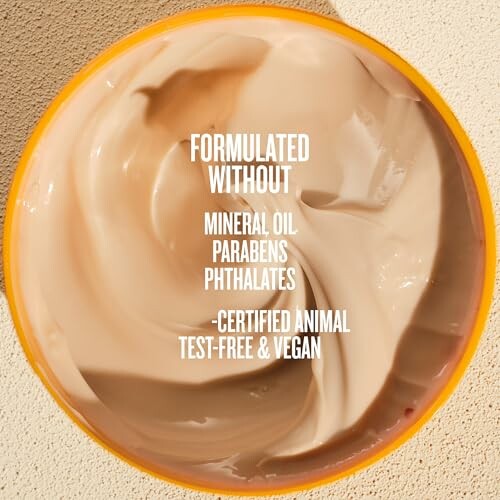 Open cream jar with text about being free from mineral oil, parabens, and phthalates, and certified vegan.